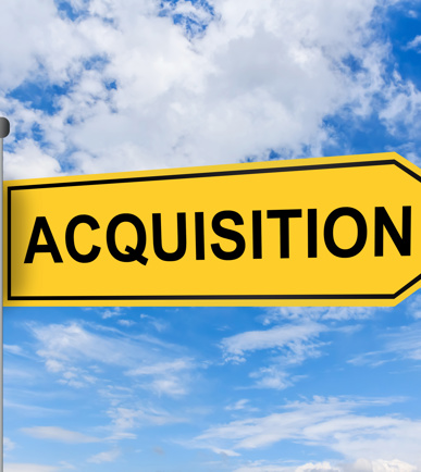 Schild mit dem englischen Begriff "Acquisition", d.h. Kauf